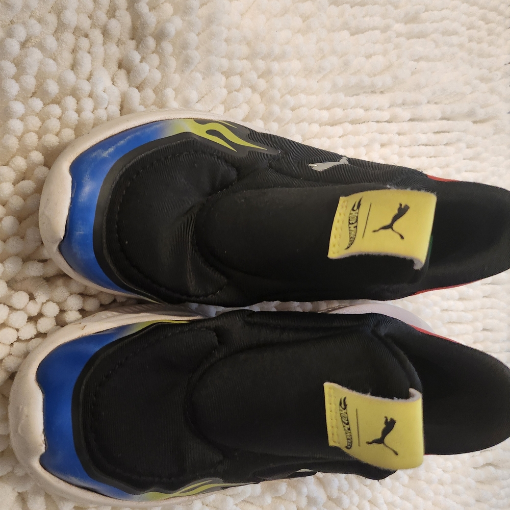 Puma Kids Black Sneakers with Blue and Yellow Accents